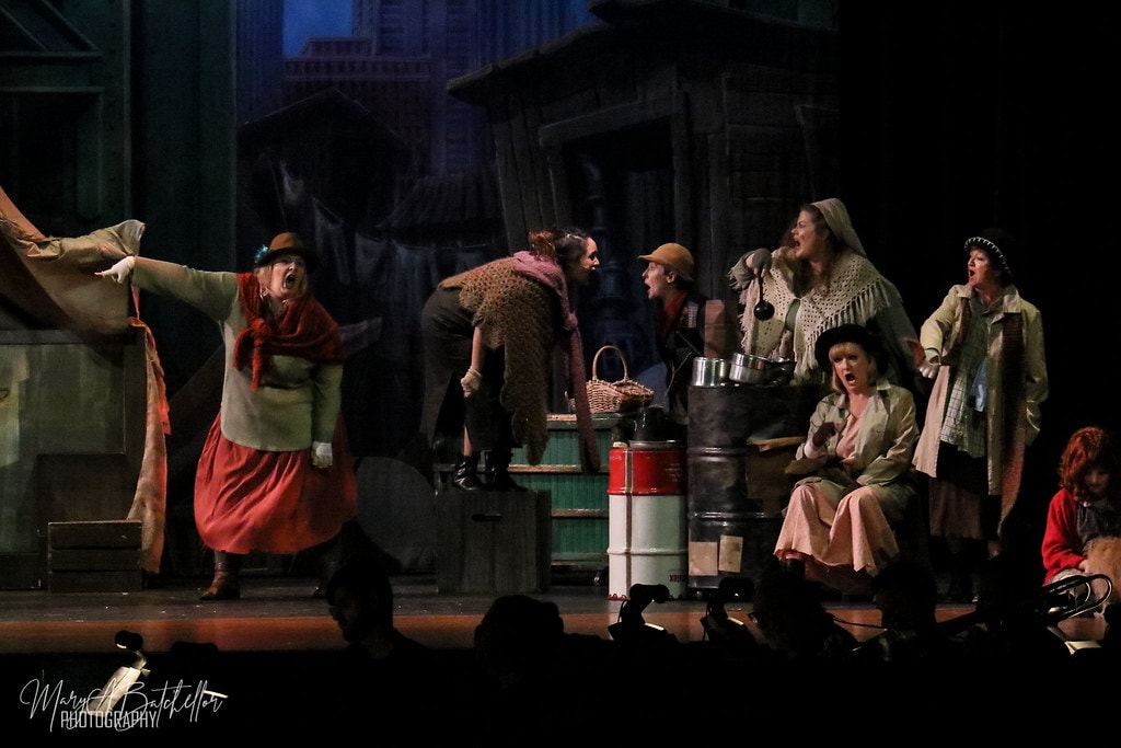 Annie — six women in ragged Depression-era costumes perform a dramatic ensemble number
