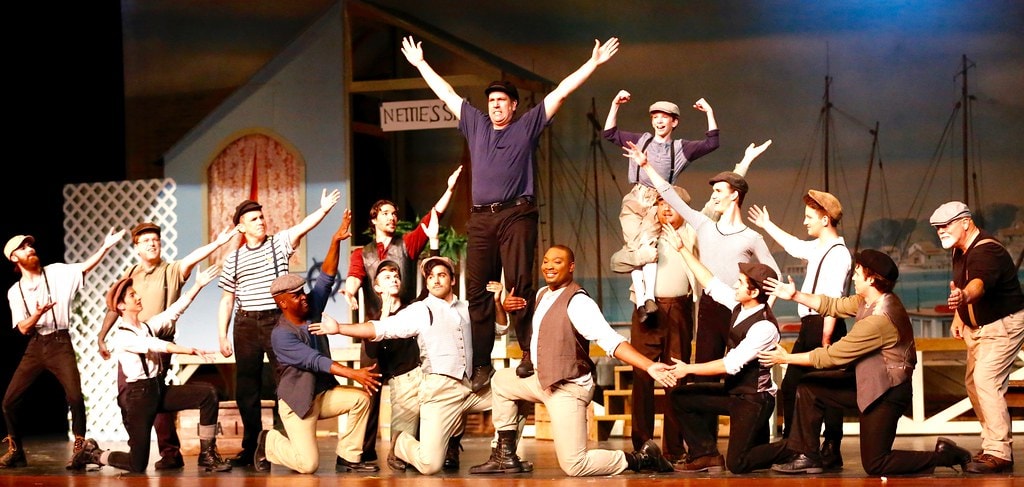 Full men's ensemble arms raised at Nettie's Spa — Carousel