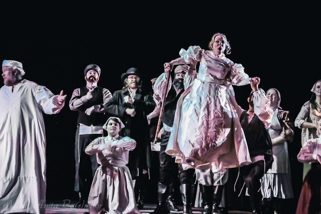 Fiddler on the Roof — the full ensemble in nightgowns dances wildly in the dream sequence, a young girl covering her ears at center stage