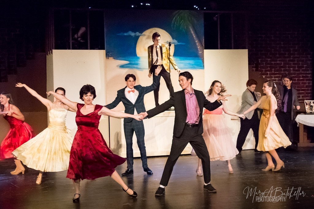 Grease — prom couple in red and black spinning center stage