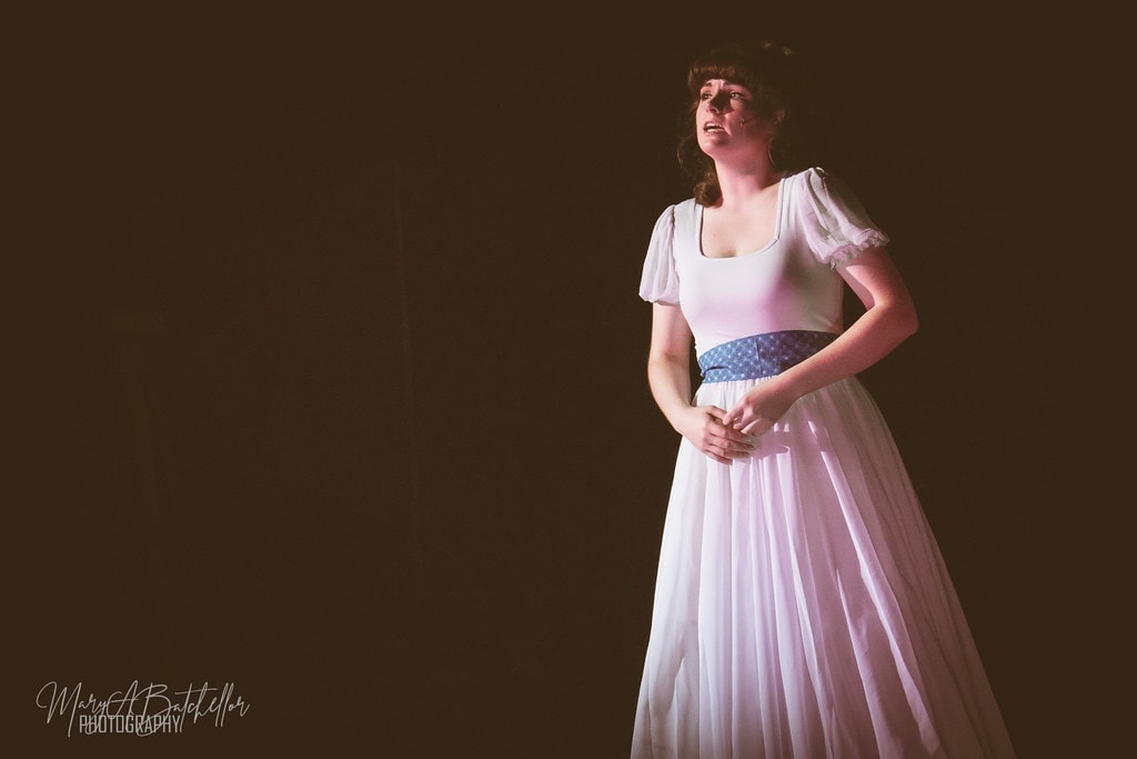 Oklahoma! — Laurey solo in white dress under warm light