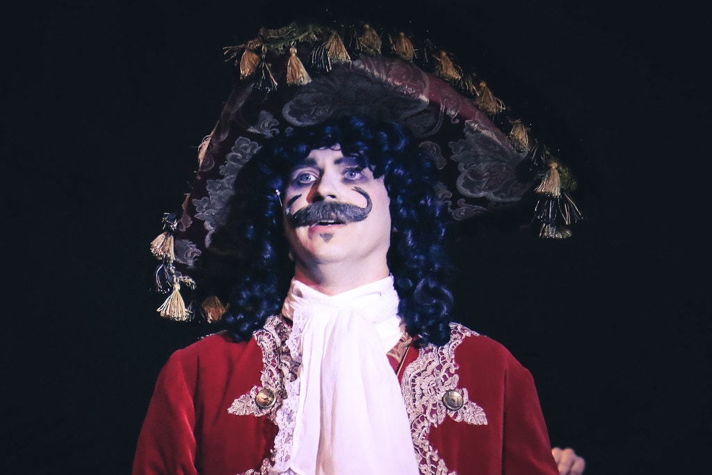 Peter Pan — Captain Hook in a dramatic close-up portrait in his red coat and ornate tricorn hat
