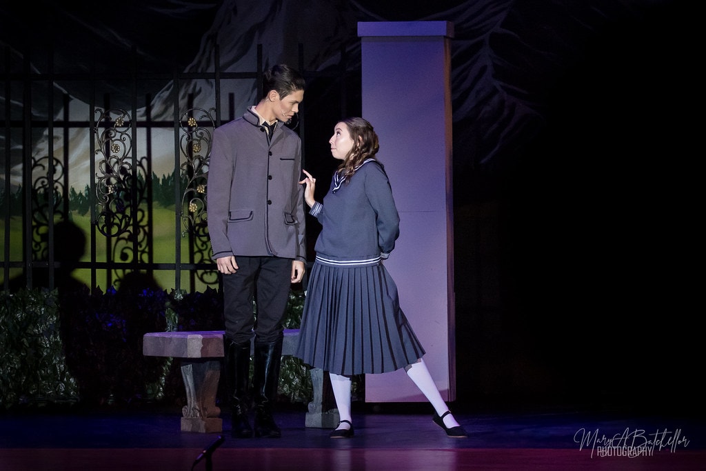 The Sound of Music — Rolf and Liesl facing each other by the garden gate