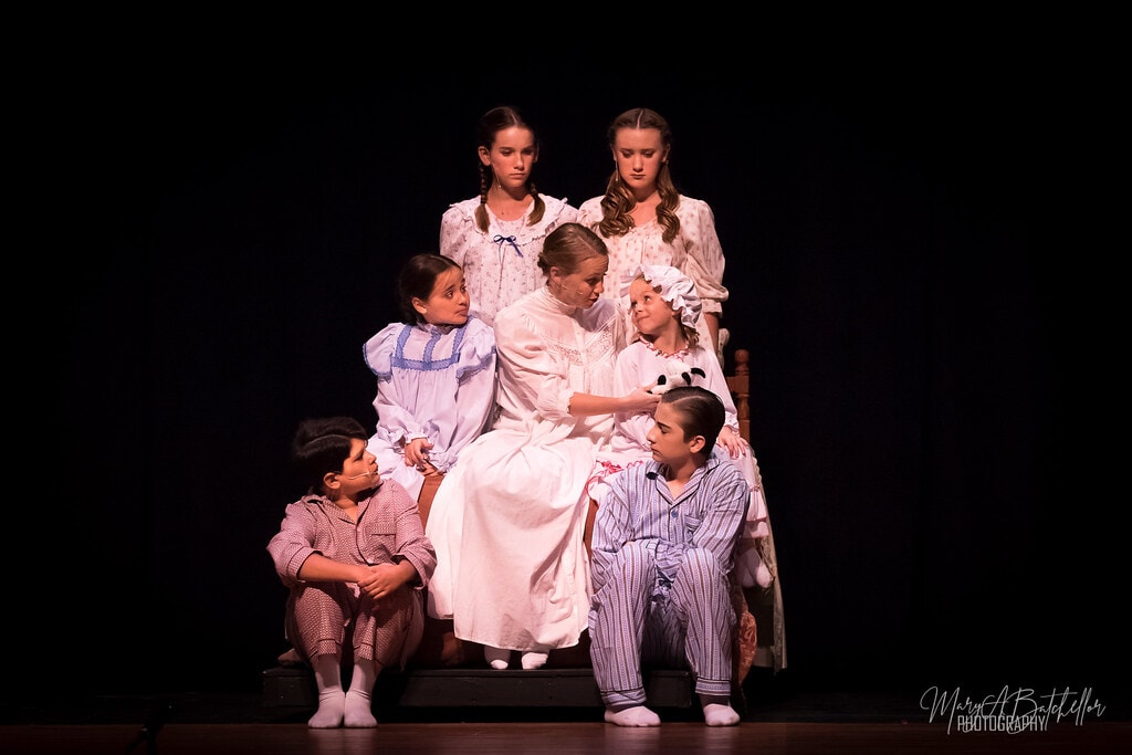 The Sound of Music — Maria surrounded by von Trapp children in pajamas