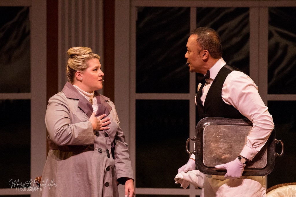 The Sound of Music — woman in grey coat and butler with silver tray