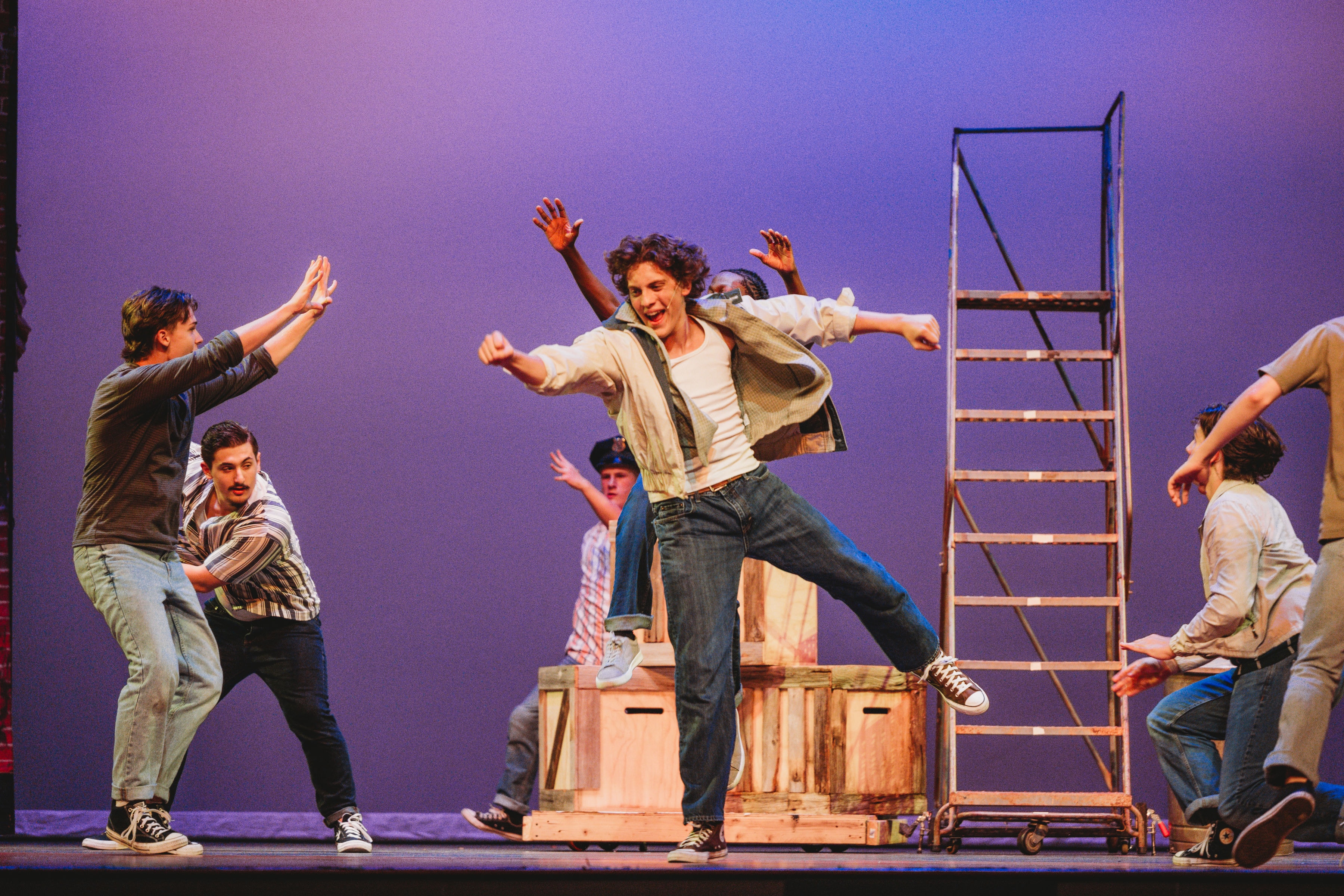 West Side Story 2026 - Tony leaping on crates surrounded by Jets gang